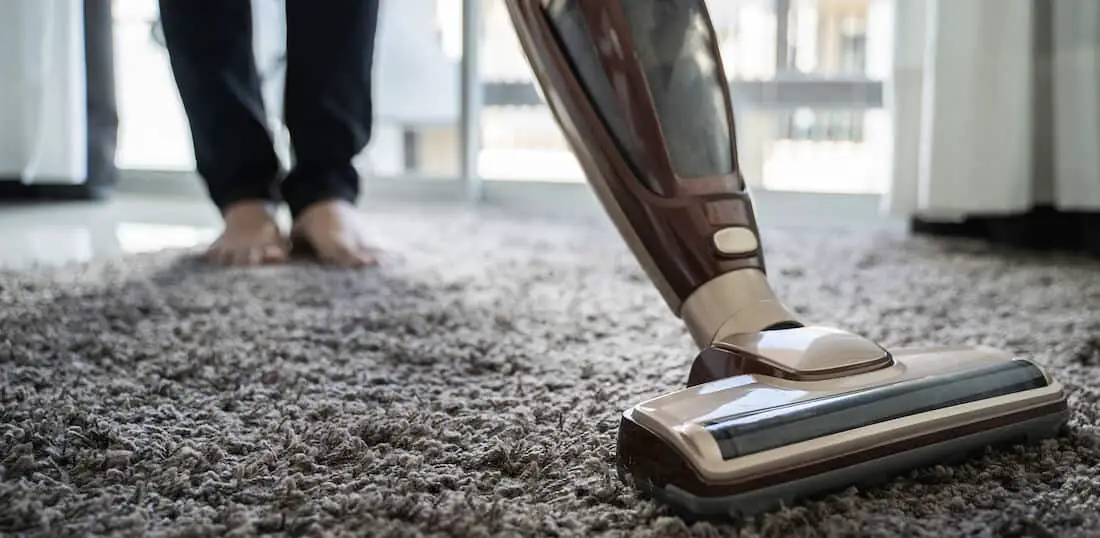 upright vacuum cleaner on carpet